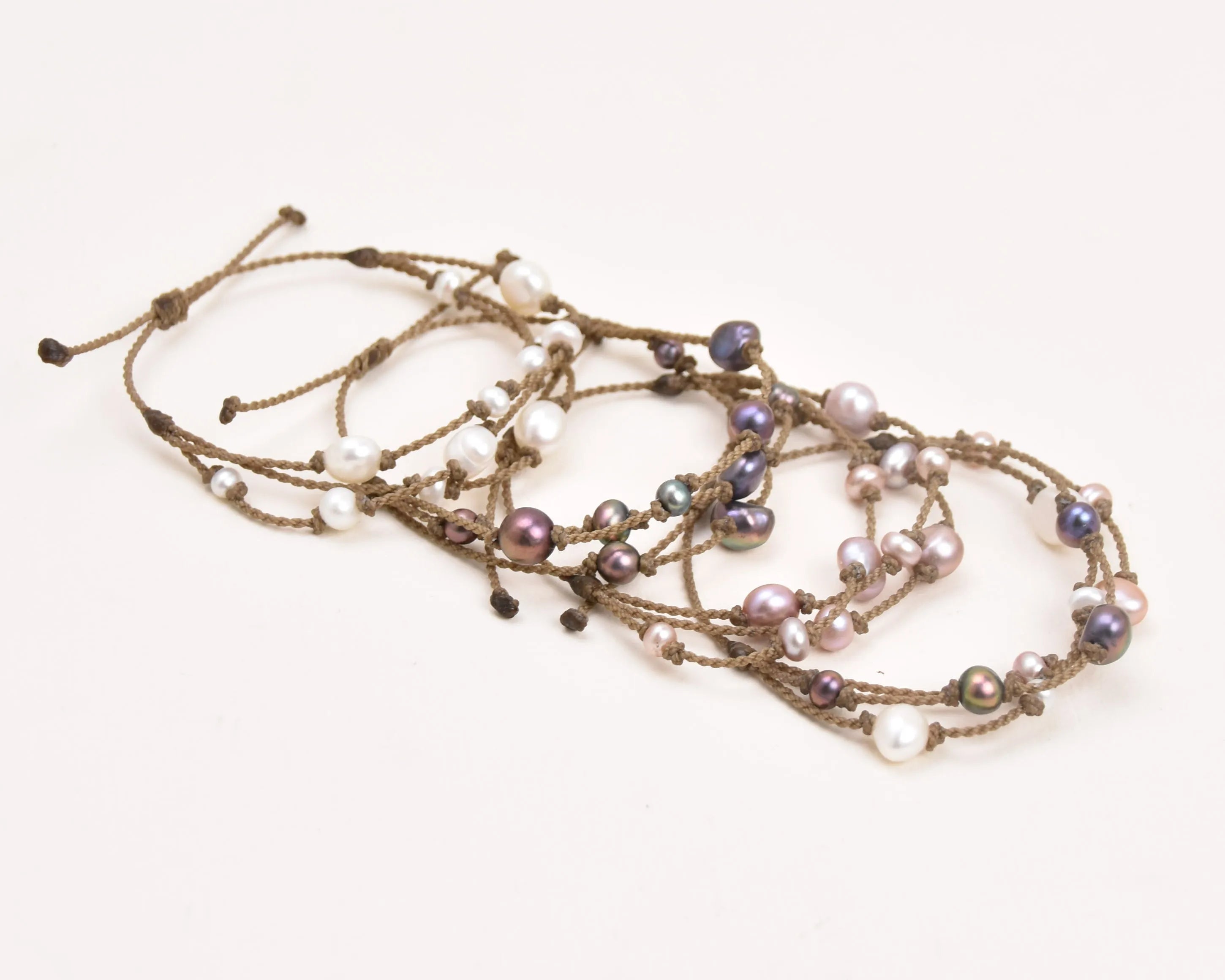 Tula Blue's Journey Bracelet in white blush peacock and mixed pearl layout