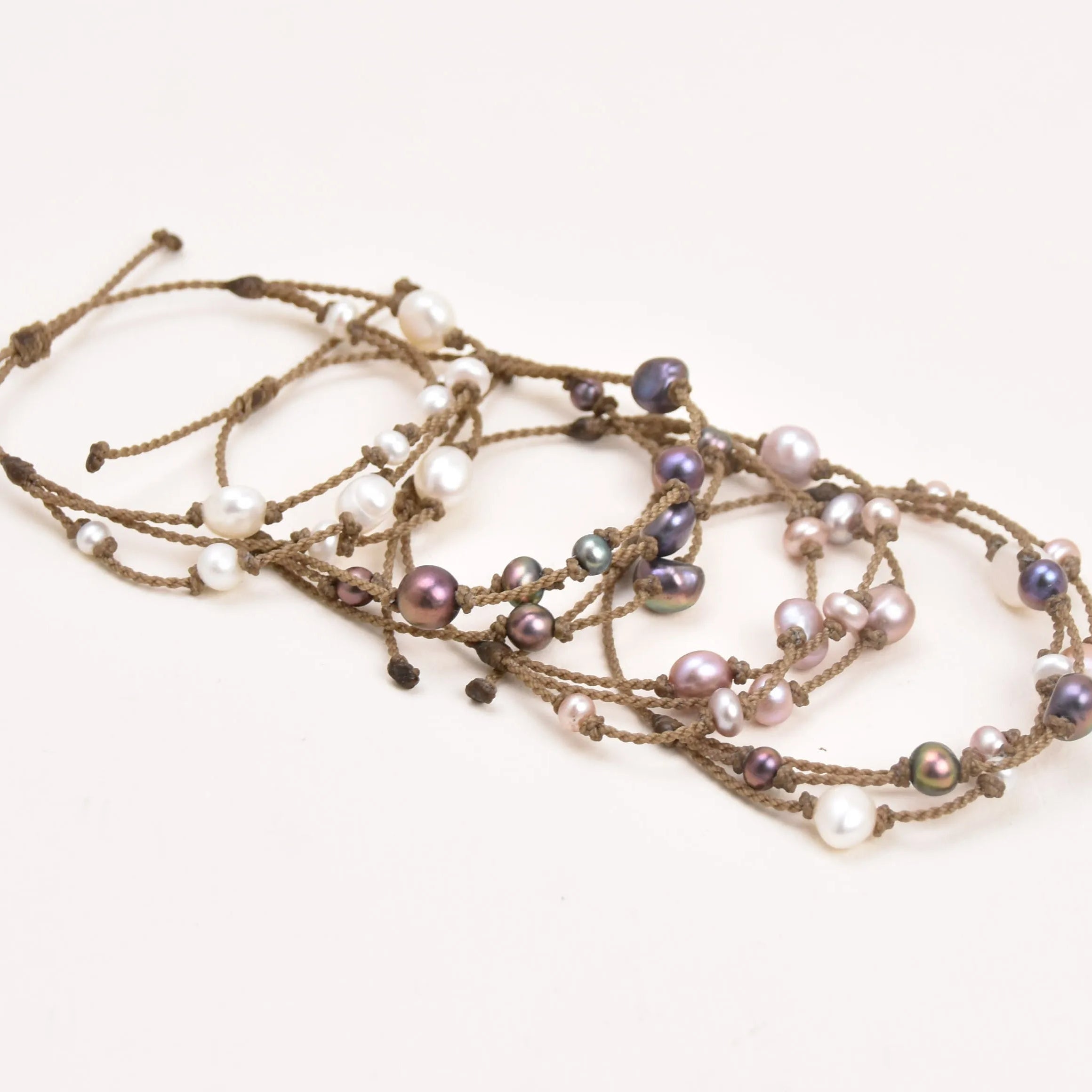 Tula Blue's Journey Bracelet in white blush peacock and mixed pearl layout