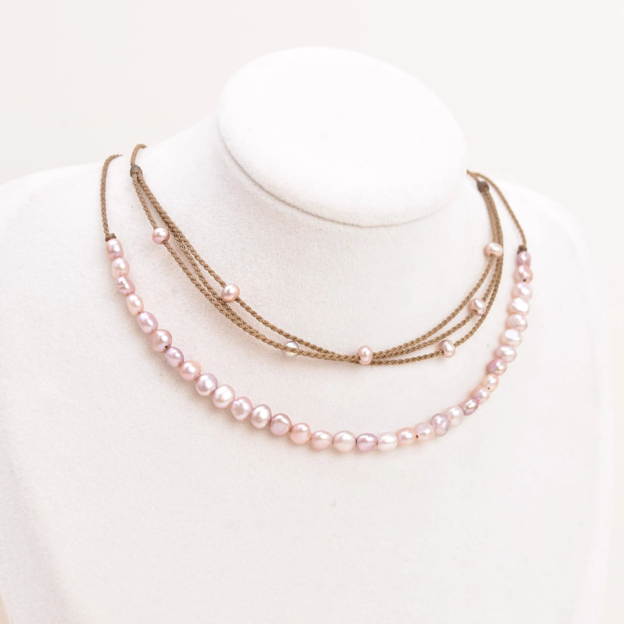 blush pearl crown necklace and blush pearl riptide necklace on bust