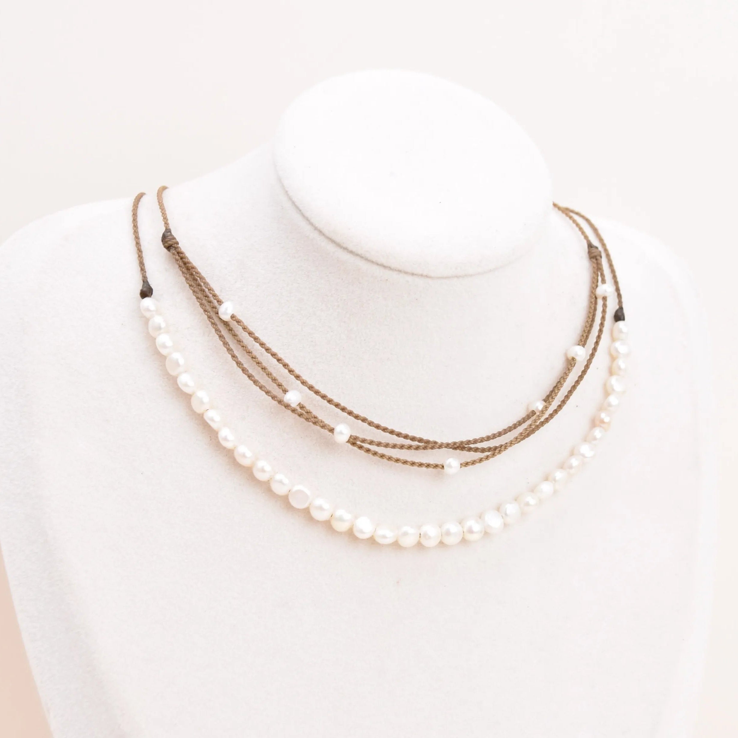 white pearl crown and white pearl riptide necklace on bust
