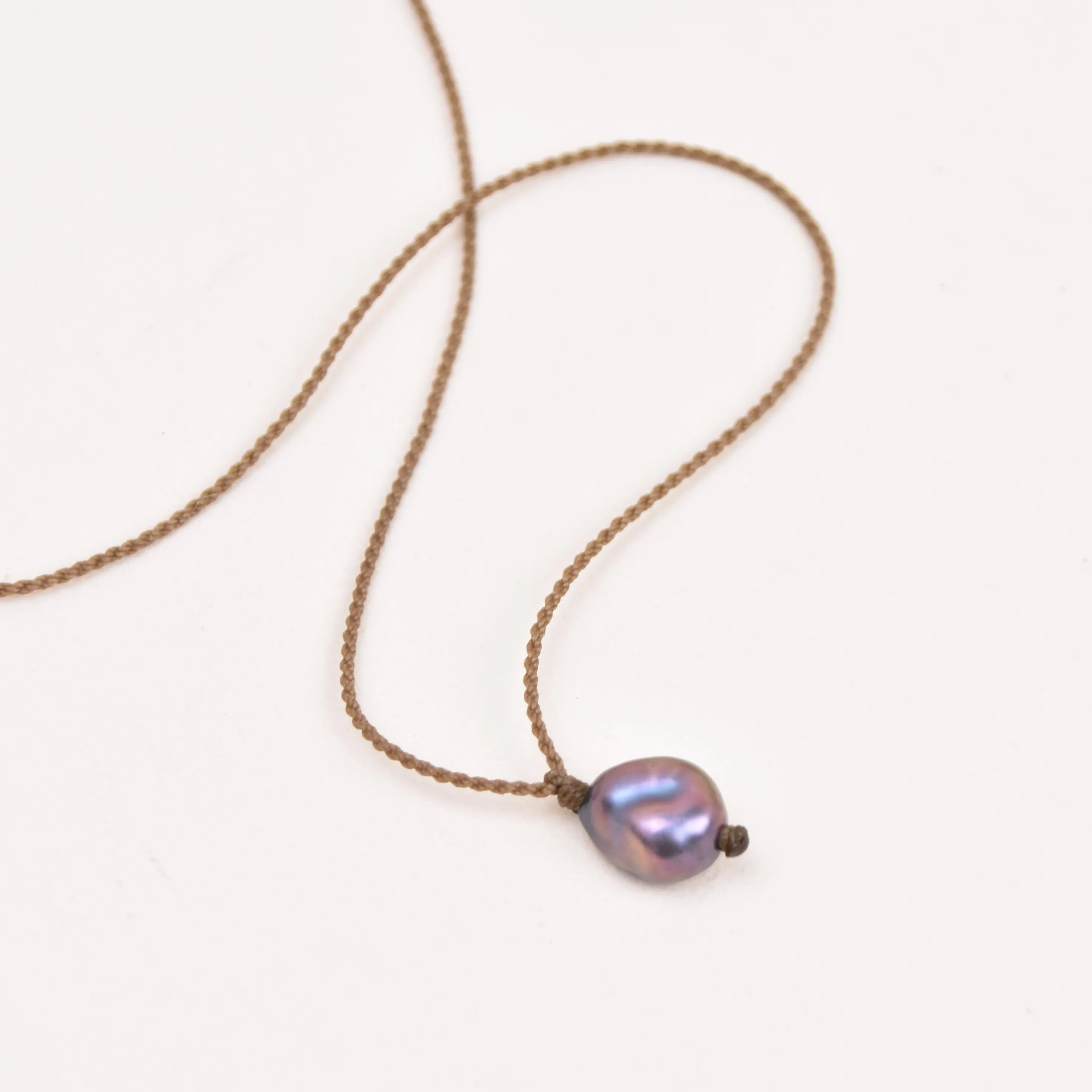Pearl Drop Necklace in Peacock on a white background