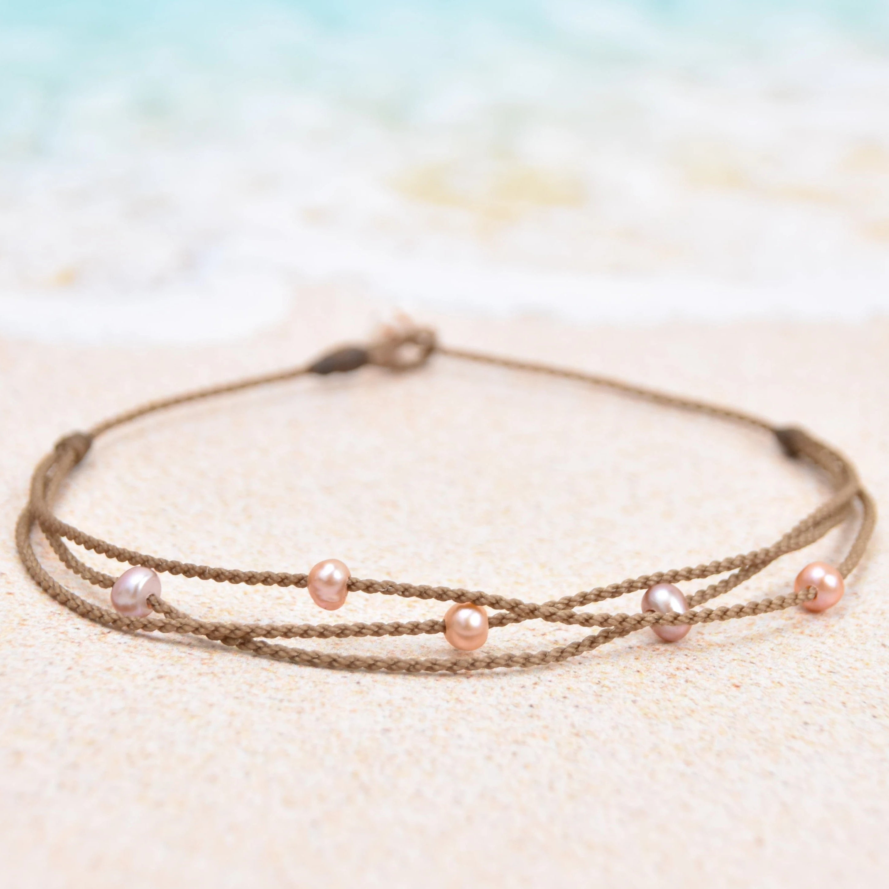 Tula Blue's waterproof Riptide anklet in white pearls. All the drama of a stack in one perfect anklet.