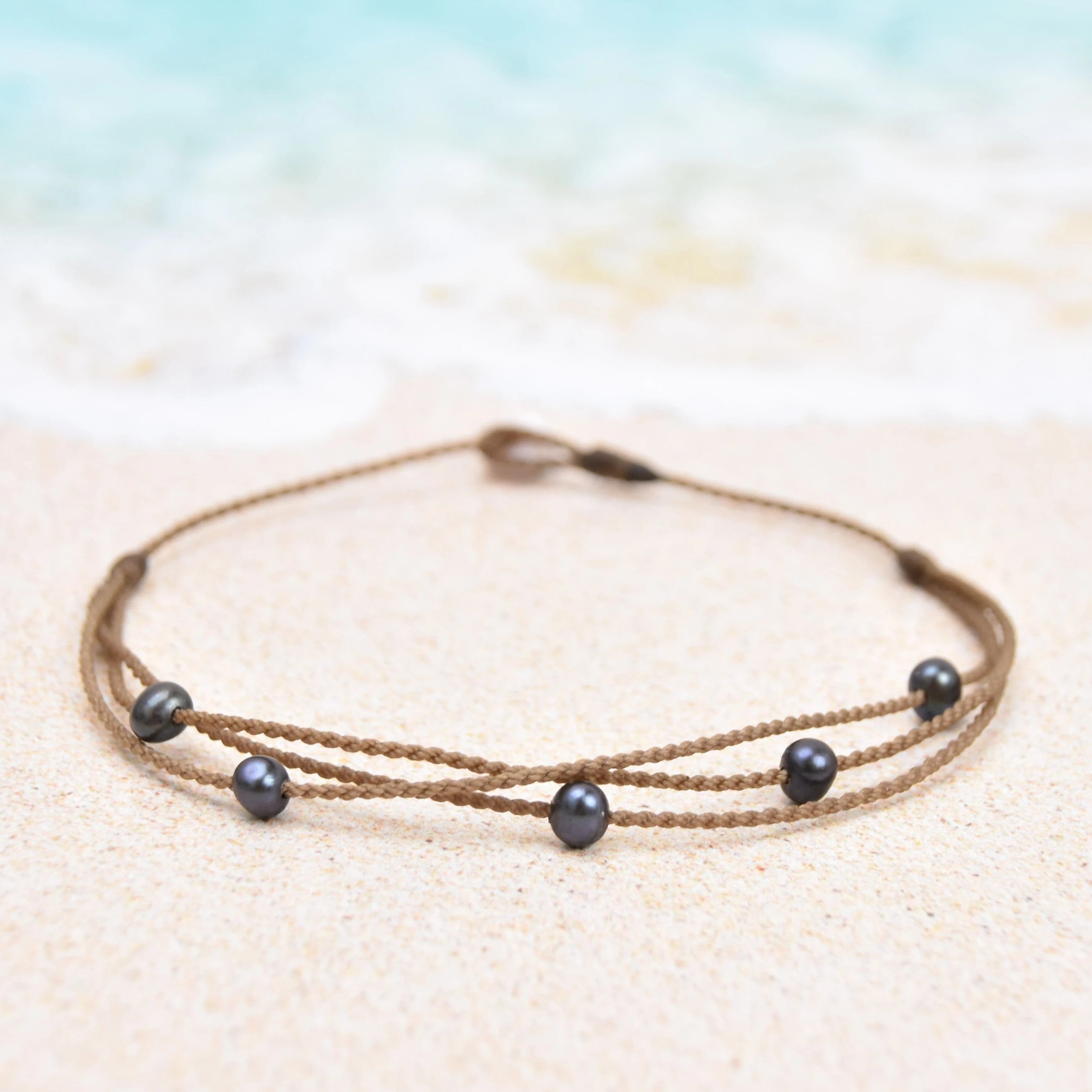 Tula Blue's waterproof Riptide anklet in peacock pearls. All the drama of a stack in one perfect anklet.