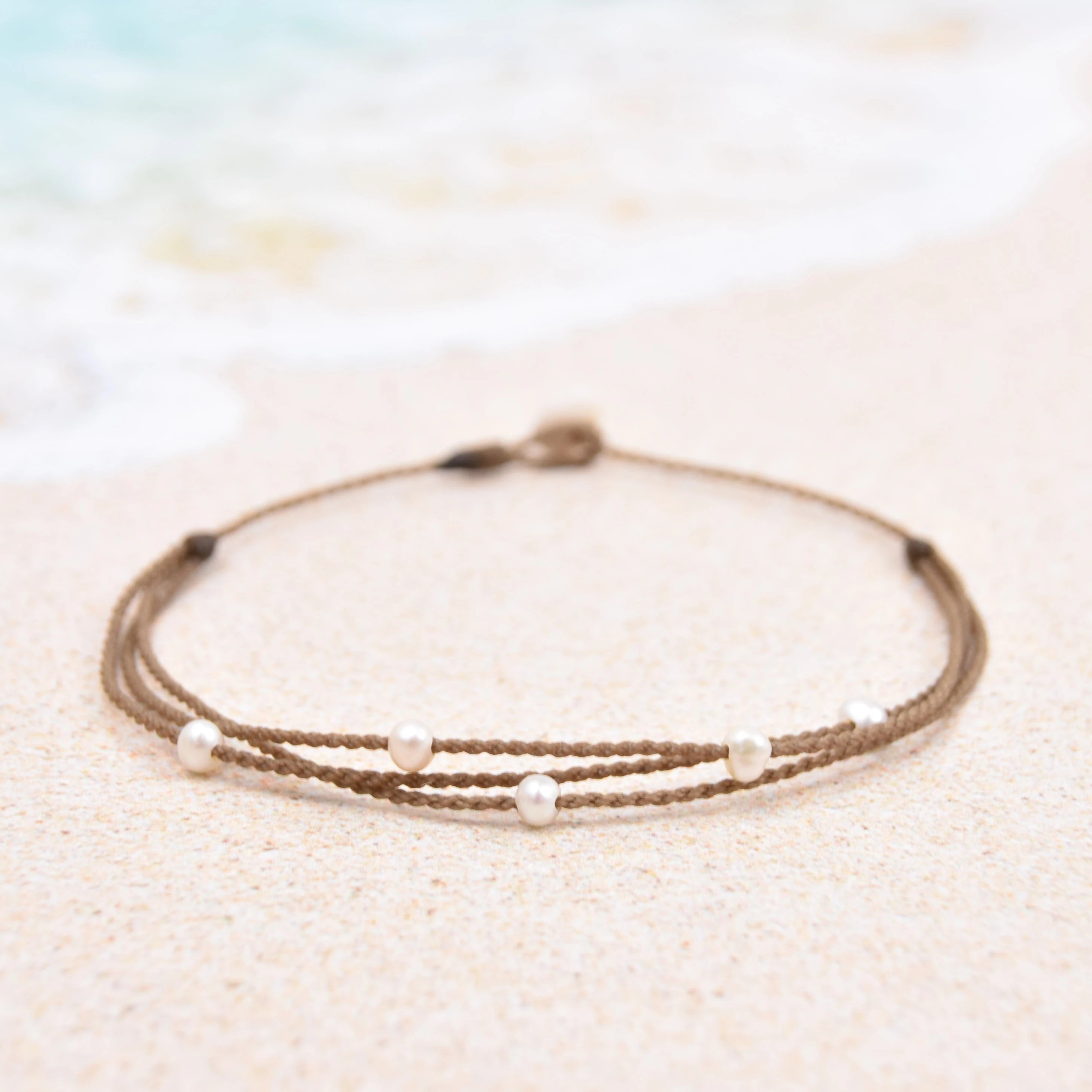 Tula Blue's waterproof Riptide anklet in white pearls. All the drama of a stack in one perfect anklet.