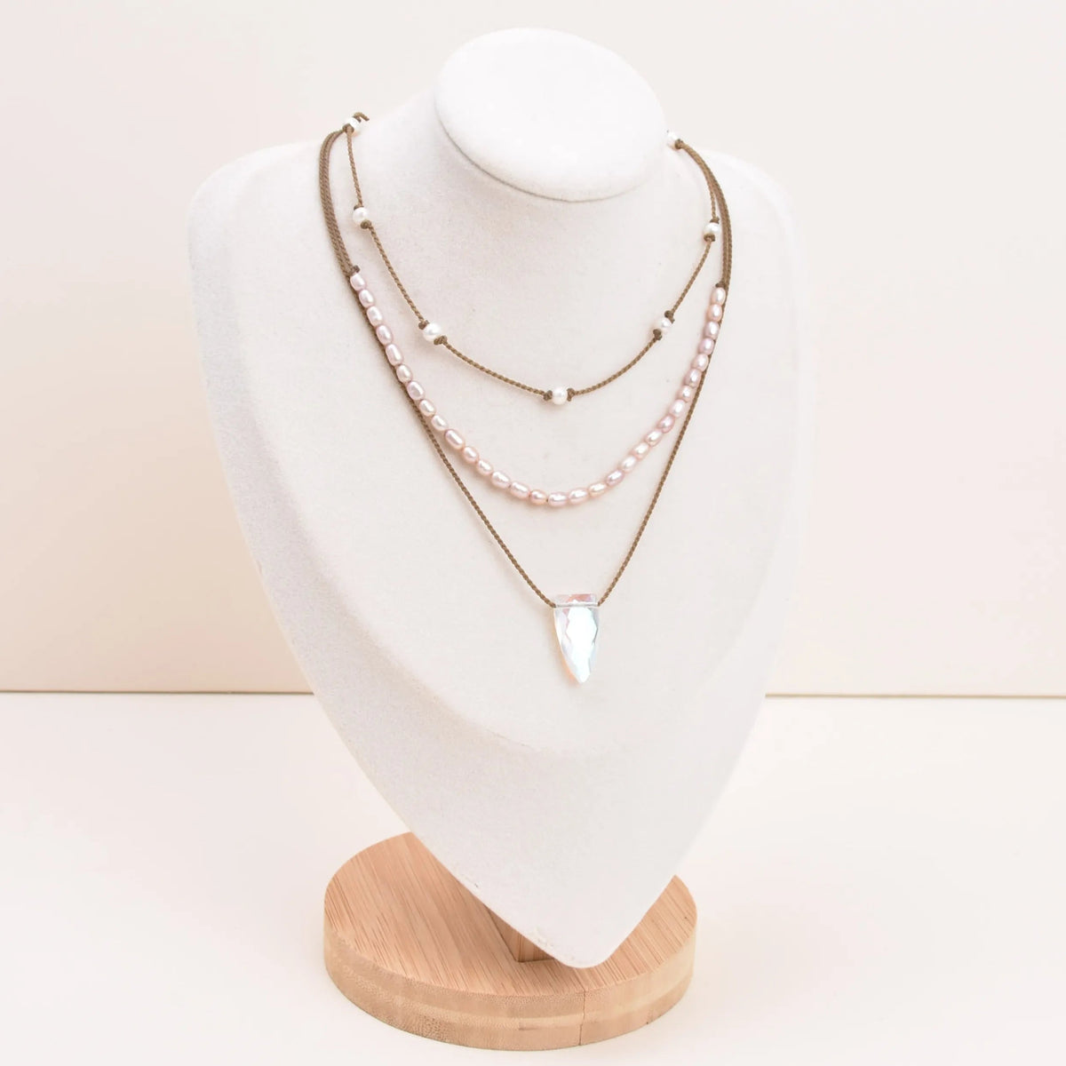 Rosy Aura Necklace Stack in white on bust with white background