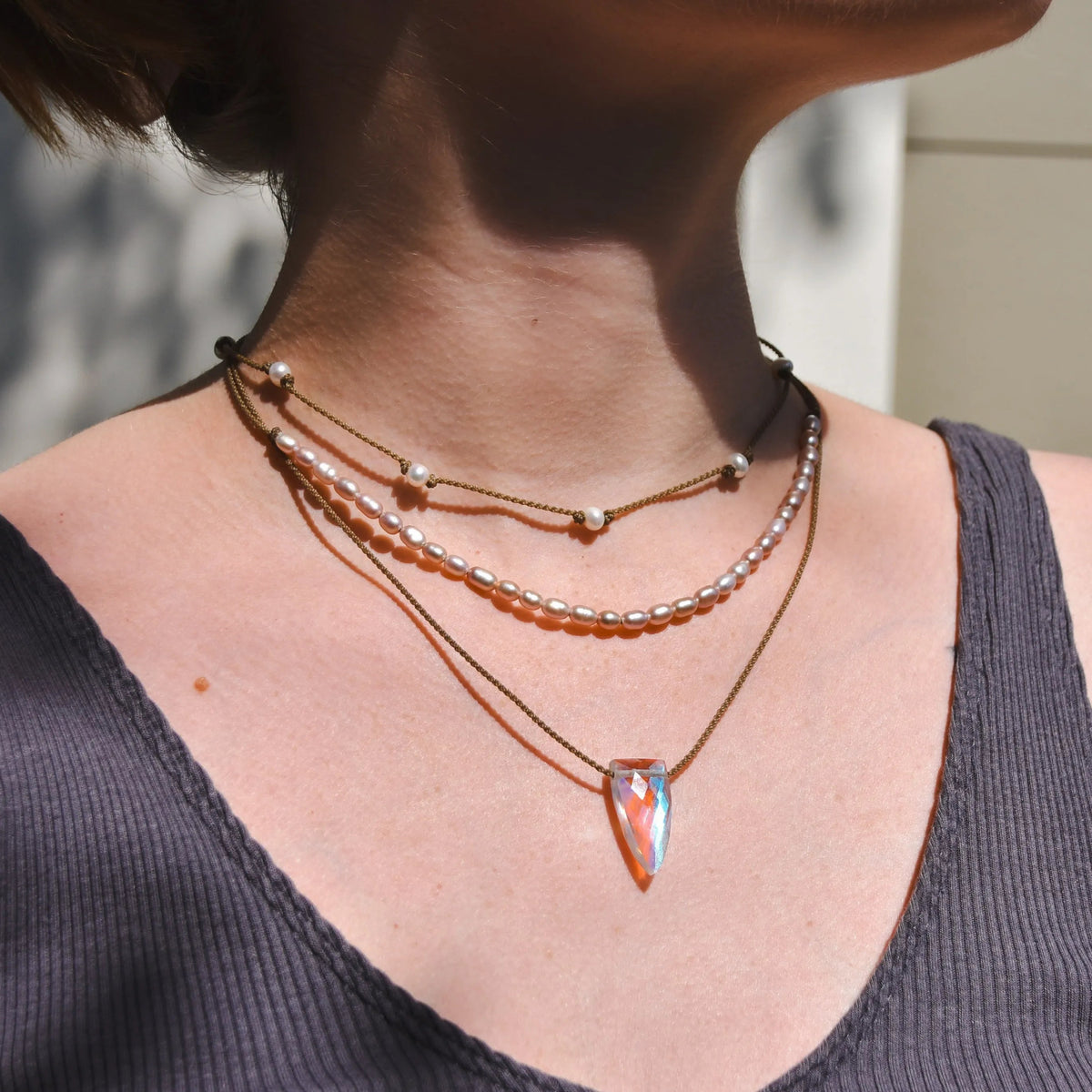 Rosy Aura Necklace Stack in white on model with white and tan background