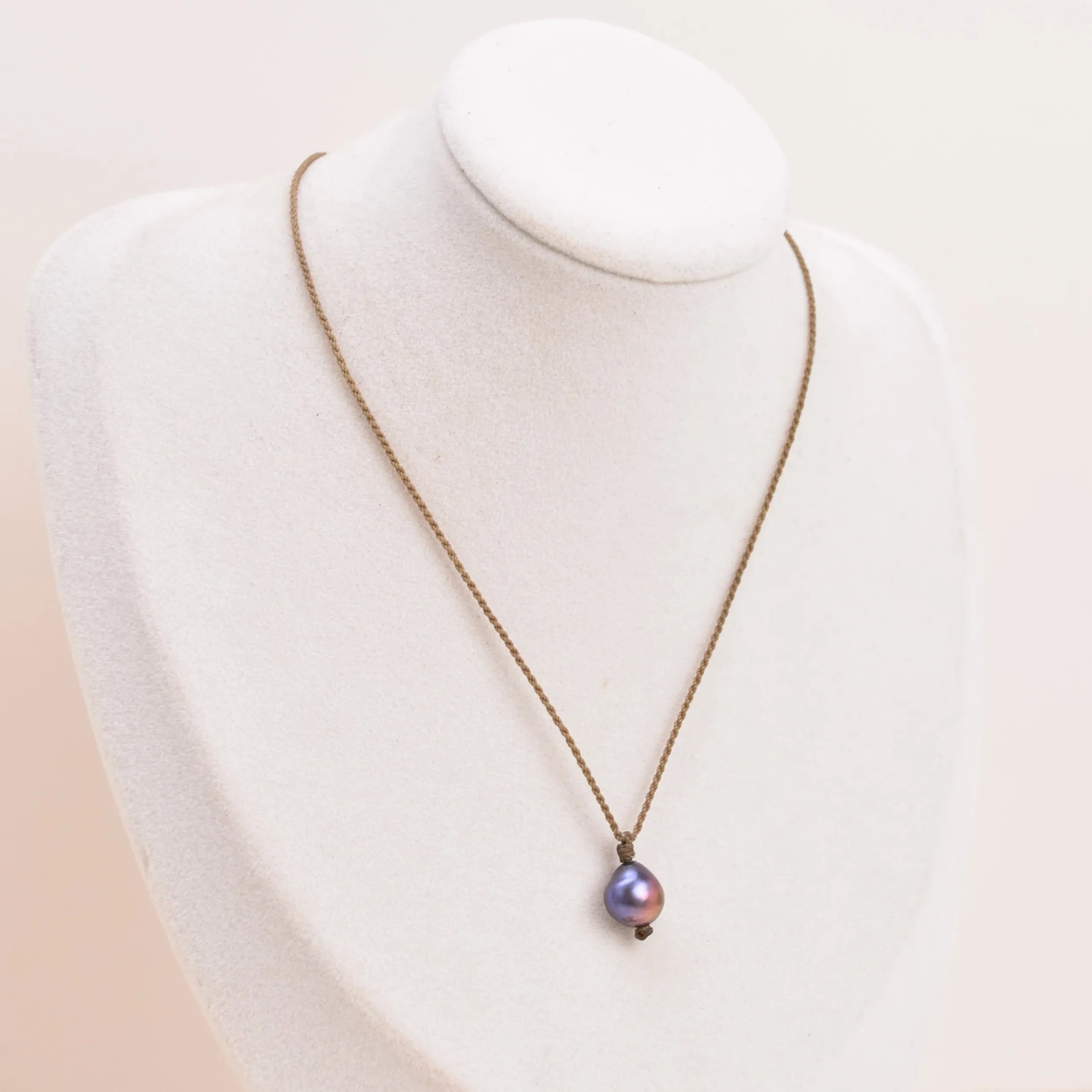 Pearl Drop Necklace in Peacock on a white bust