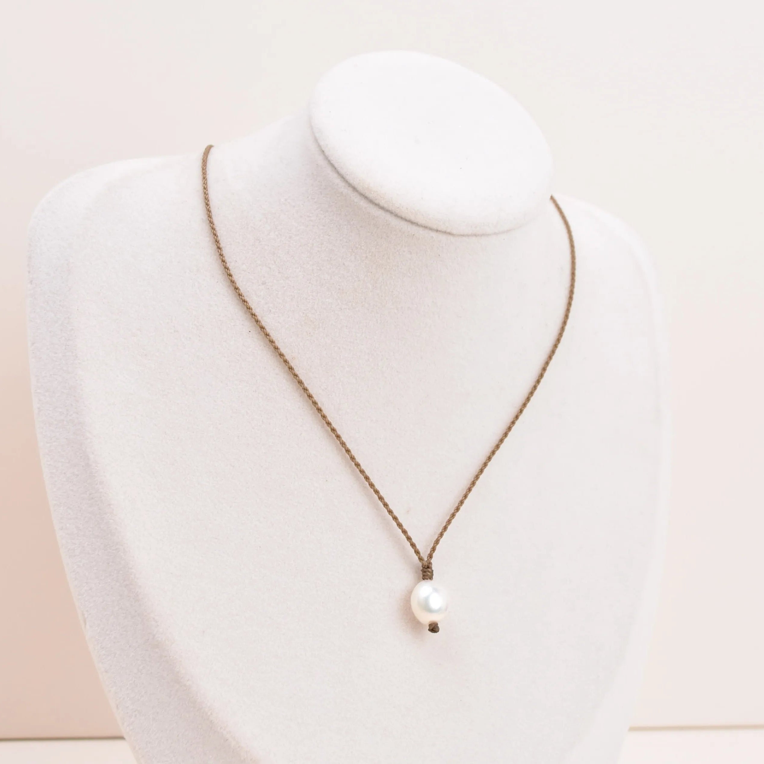 Pearl Drop Necklace in white on white bust