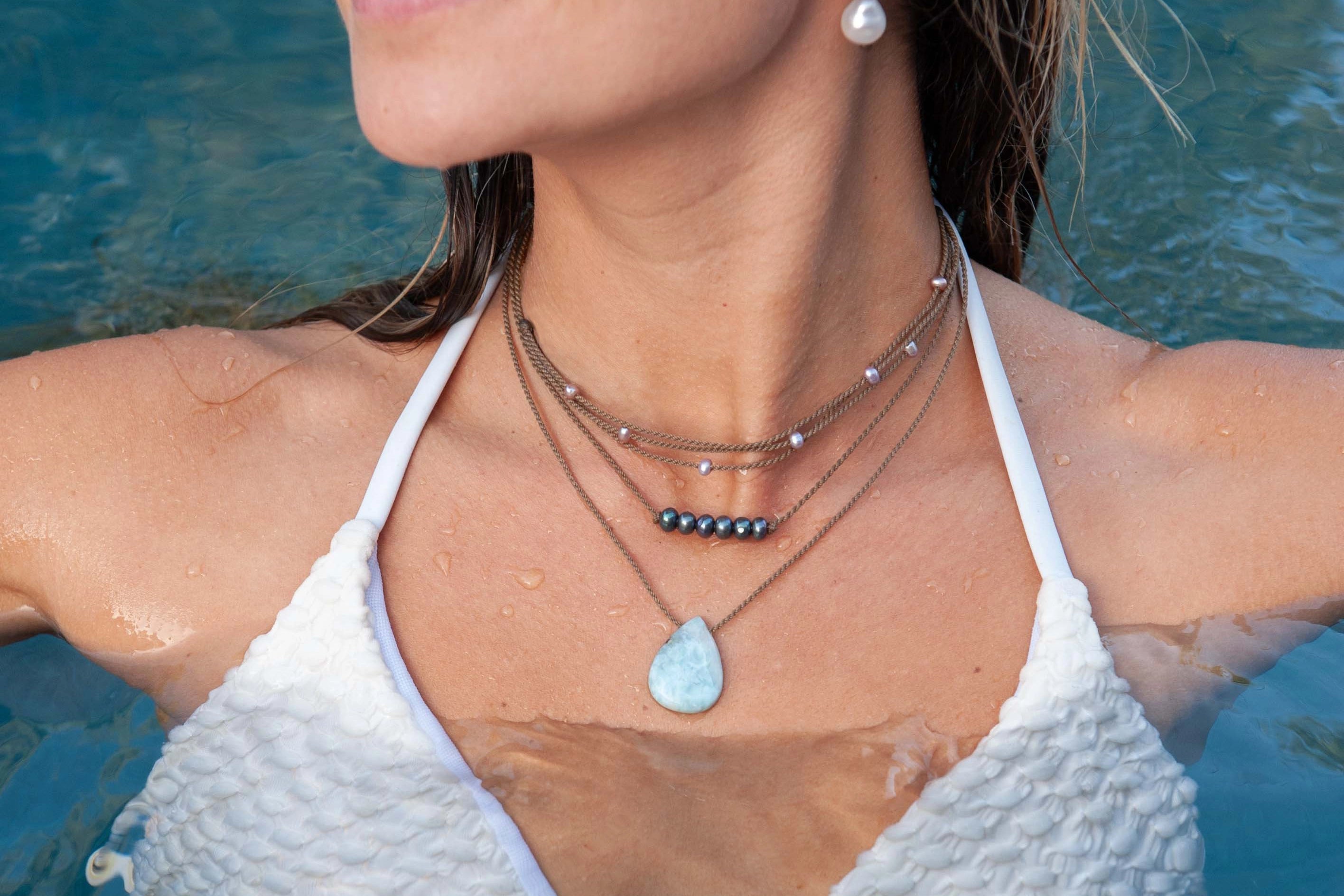 Tula Blue waterproof rope jewelry worn in ocean water.