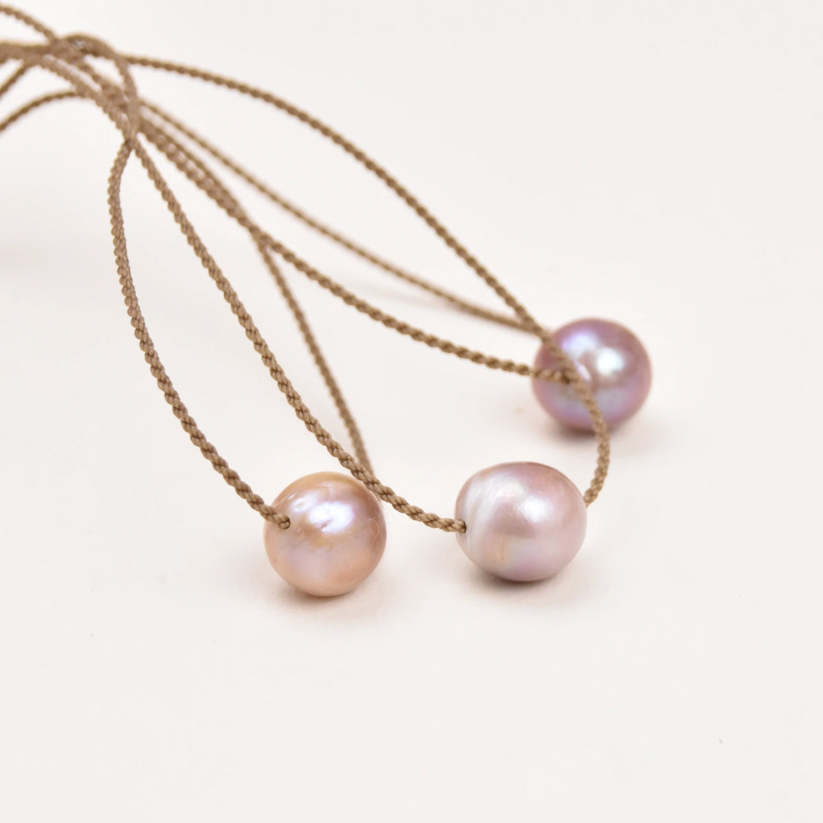 Three Classic Pearl Necklaces without knots, each with a blush pink Edison freshwater pearl on hand-spun rope