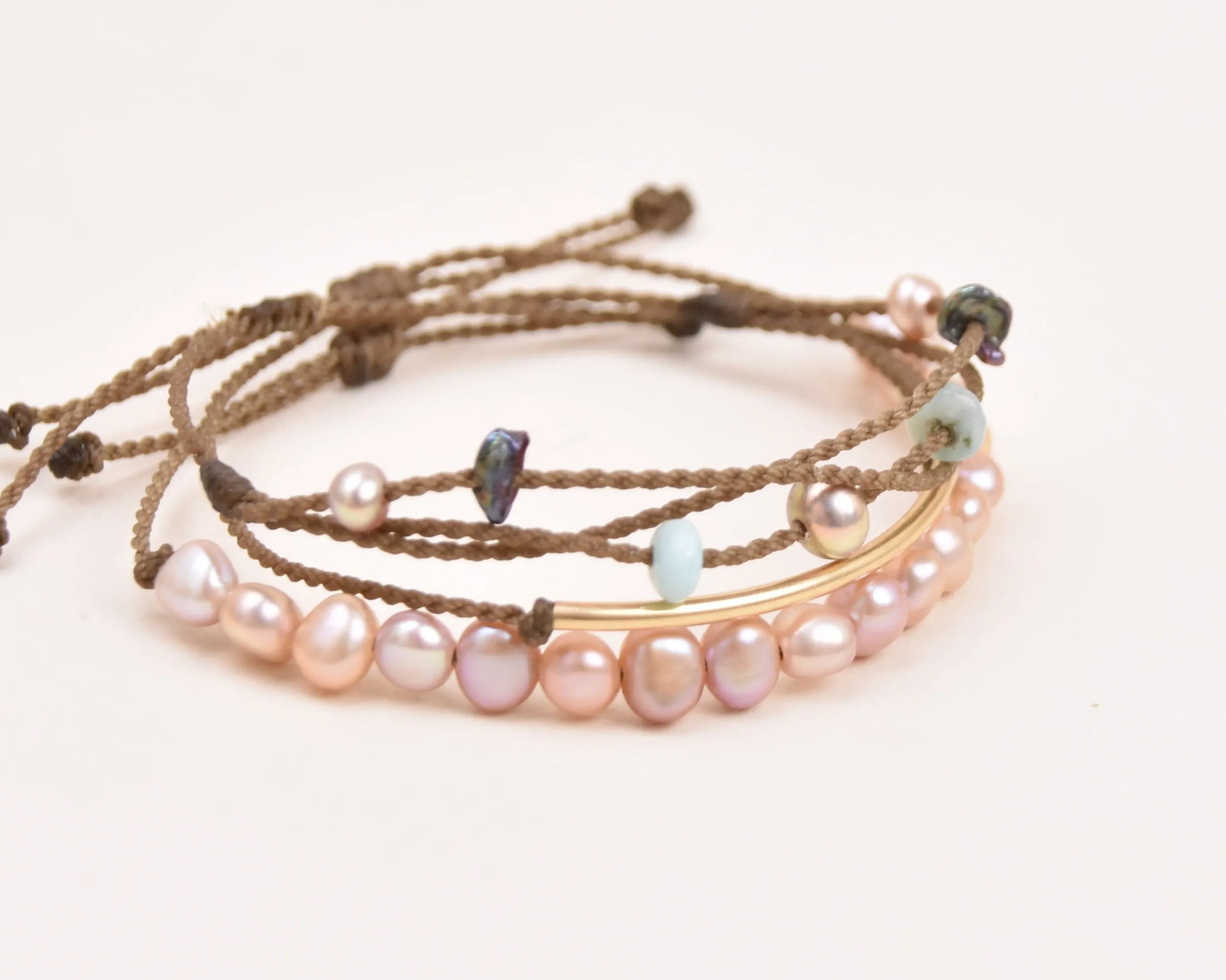 crown of the seven seas bracelet stack in blush on white background