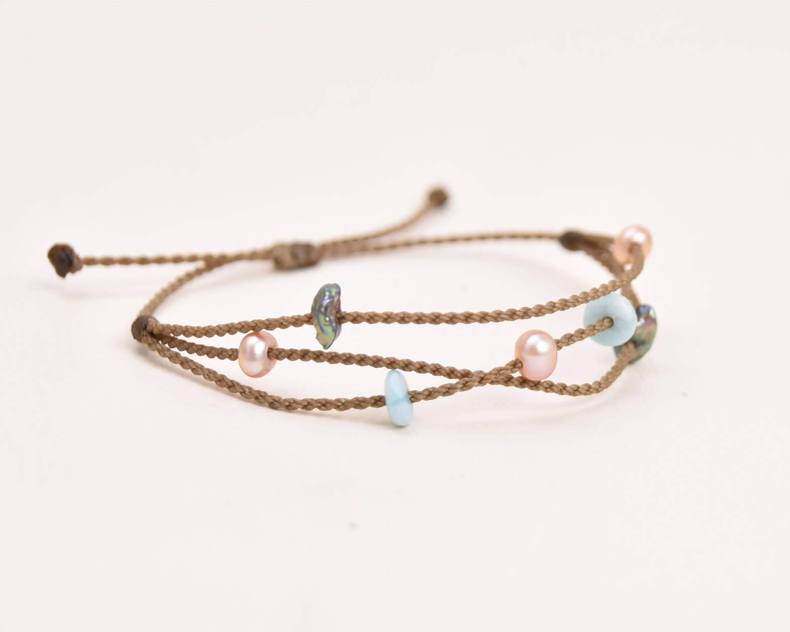 Seven Seas X PADI Riptide Bracelet with central blush pearl on white background