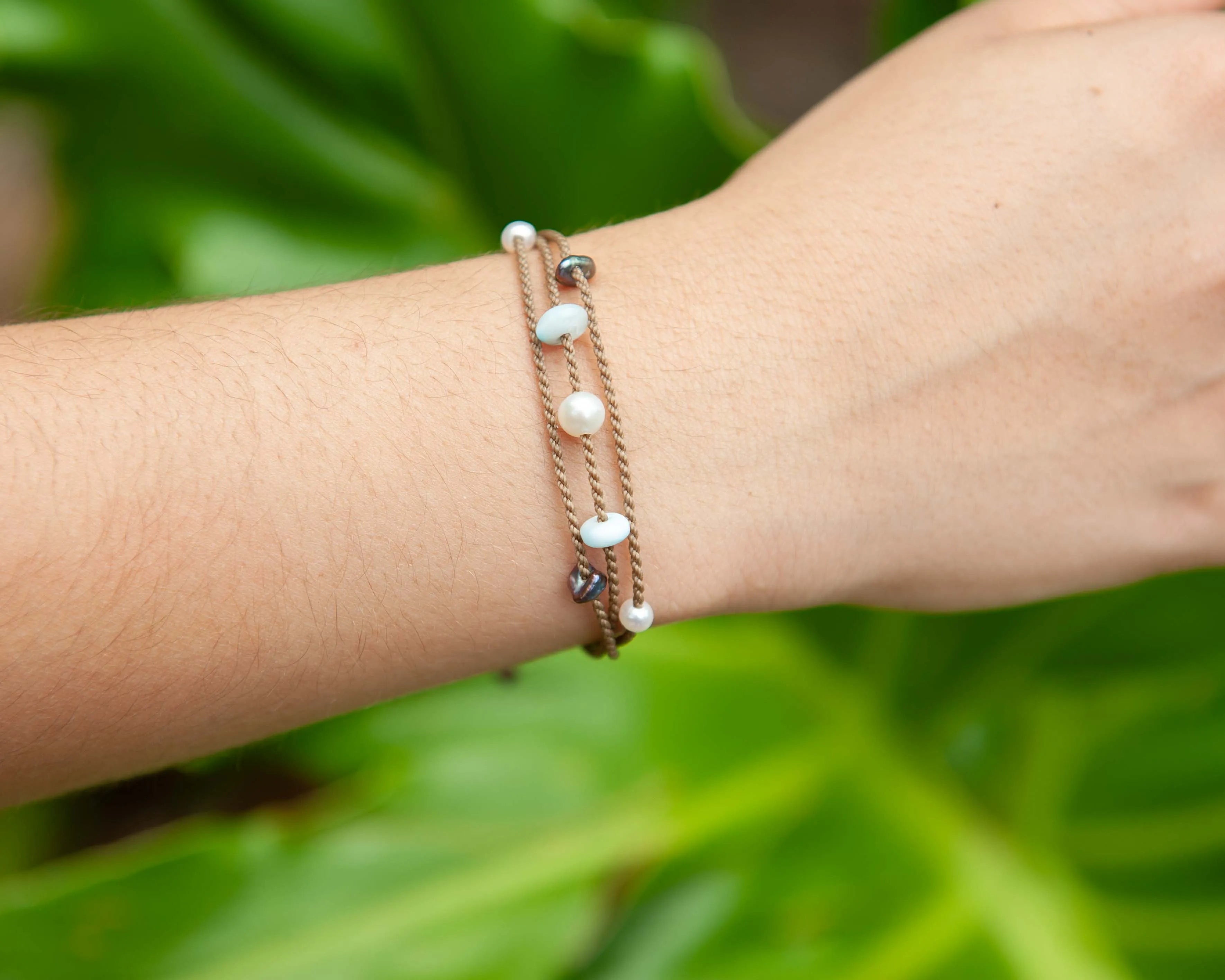 Seven Seas X PADI Riptide Bracelet with white pearl on wrist as a closeup