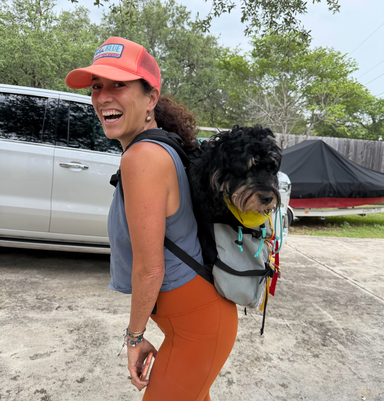 Heather Stringer, Founder of Tula Blue, with her dog, Willow, in a backpack