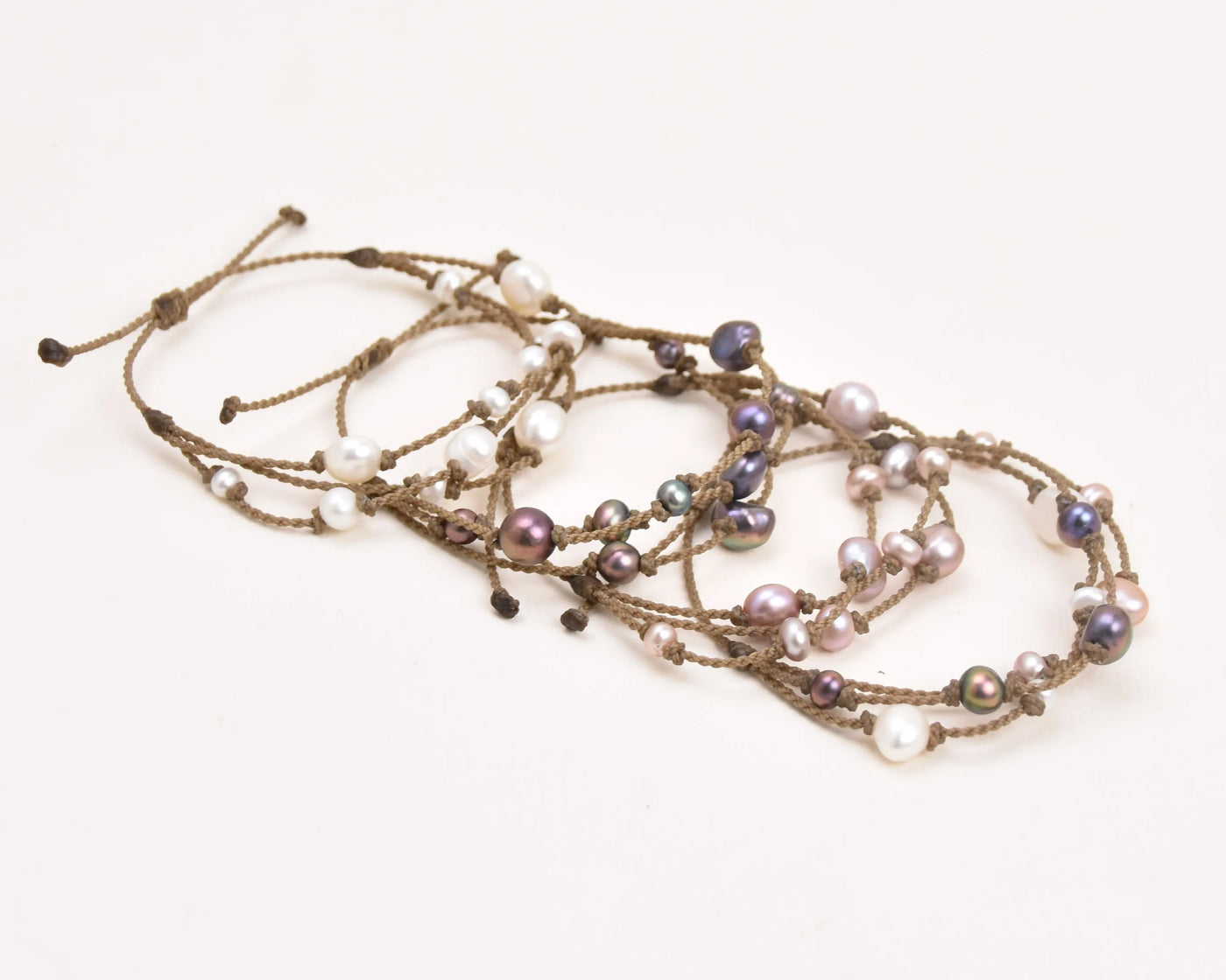 Tula Blue's Journey Bracelet in white blush peacock and mixed pearl layout