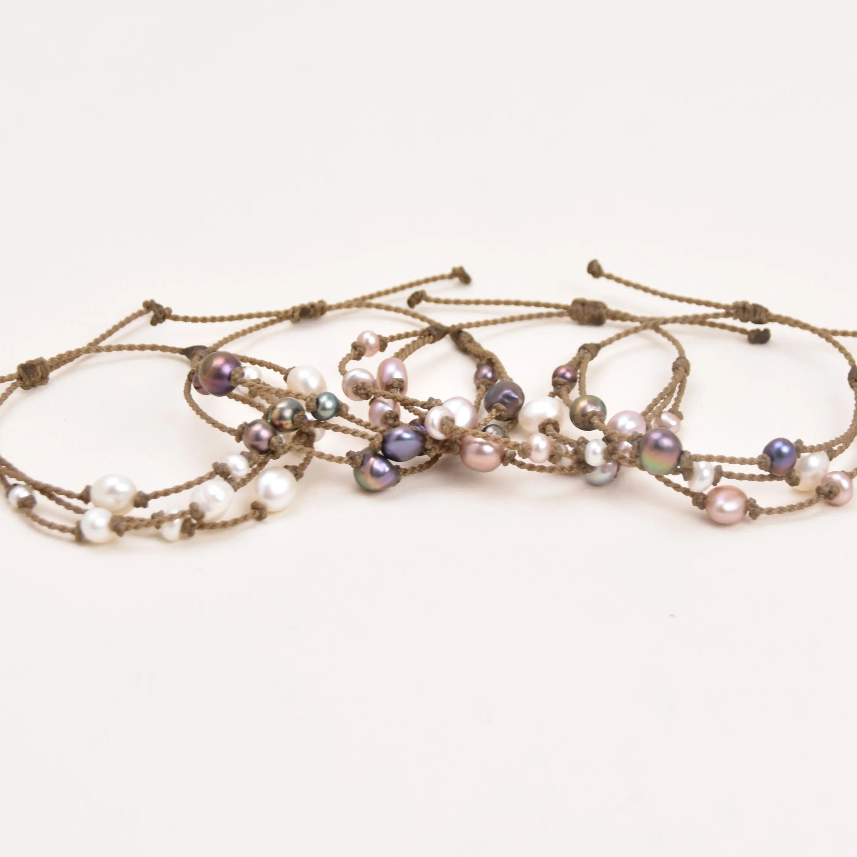Tula Blue's Journey Bracelet in white blush peacock and mixed pearl overlayed