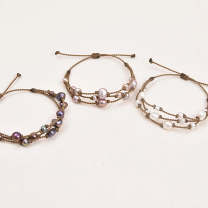 Tula Blue's Journey Bracelet in peacock blush and white pearl trio layout