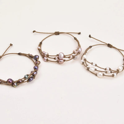 Tula Blue's Journey Bracelet in peacock blush and white pearl trio layout