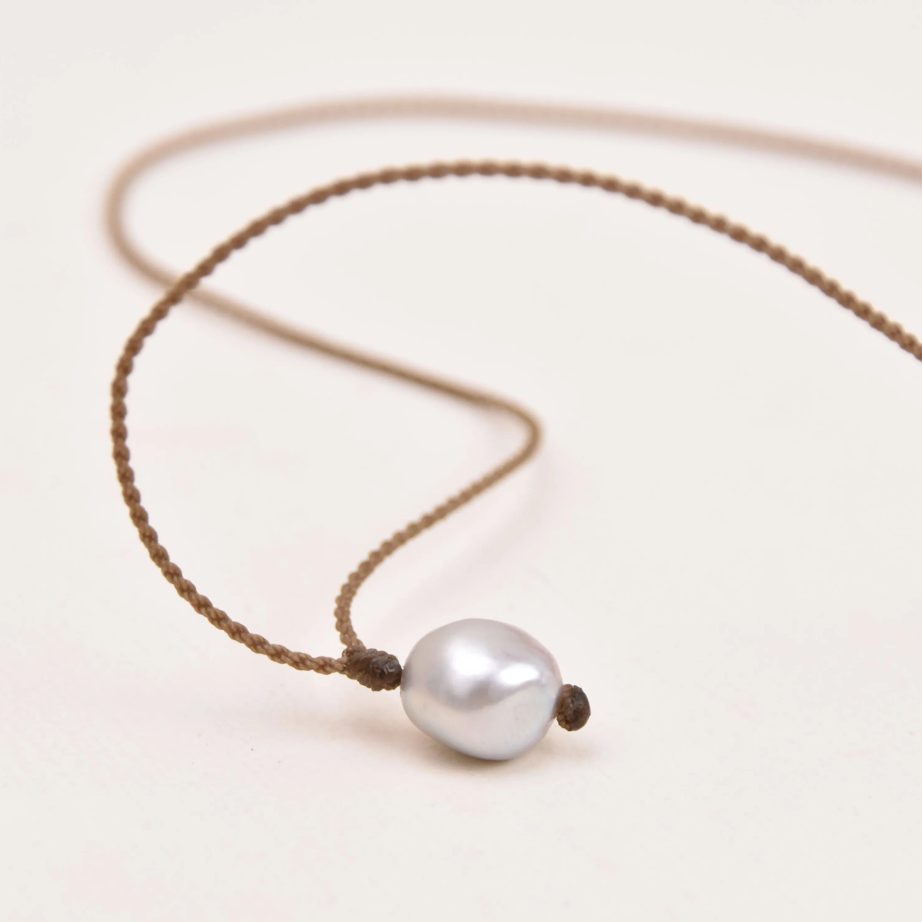 Pearl Drop Necklace in Silver on a white background