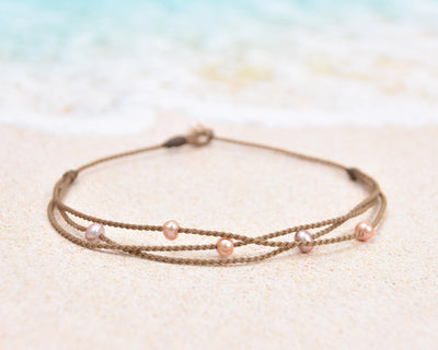 Tula Blue's waterproof Riptide anklet in white pearls. All the drama of a stack in one perfect anklet.