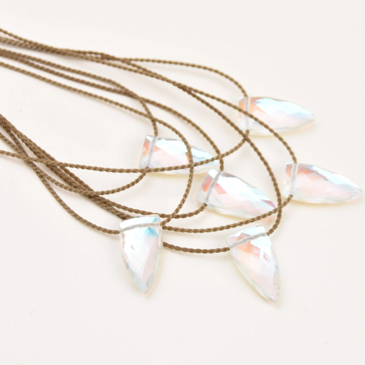 Aurora quartz necklaces layout on white background