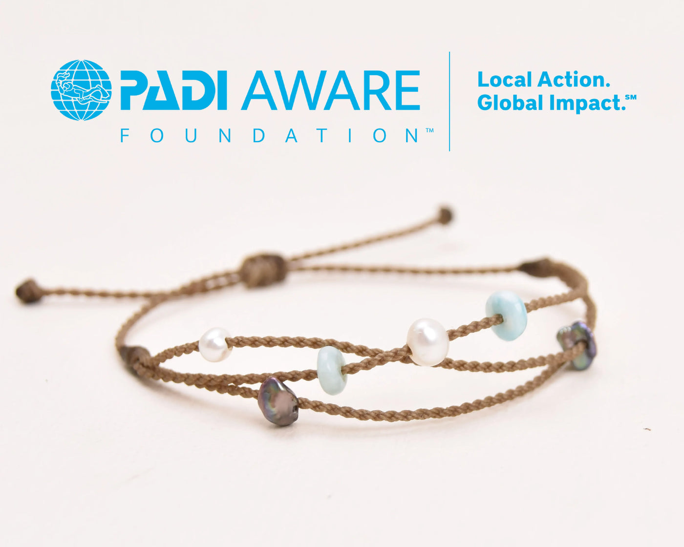 Seven Seas X PADI Riptide Bracelet with white central pearl on white background