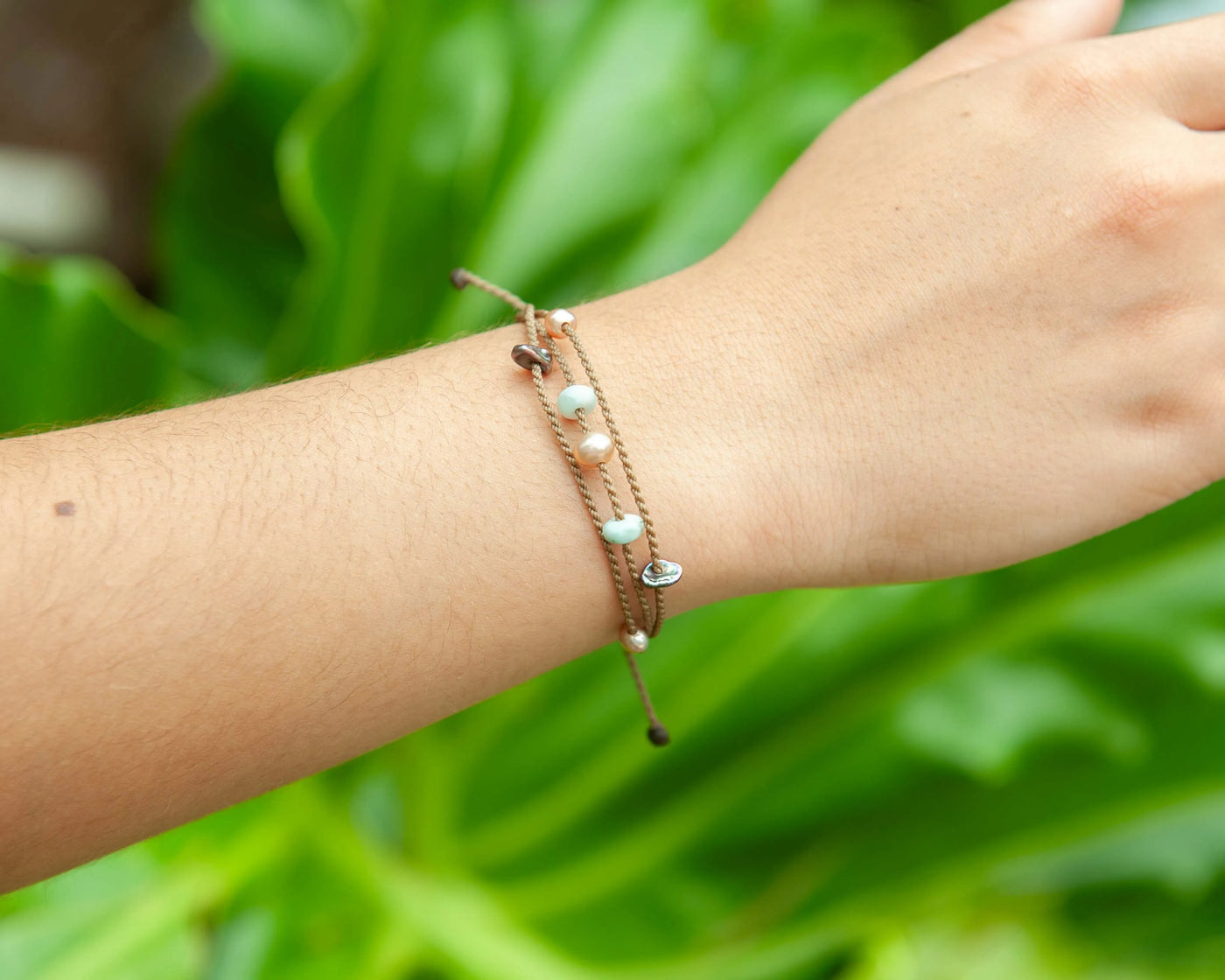 Seven Seas X PADI Riptide Bracelet with blush pearl on model wrist