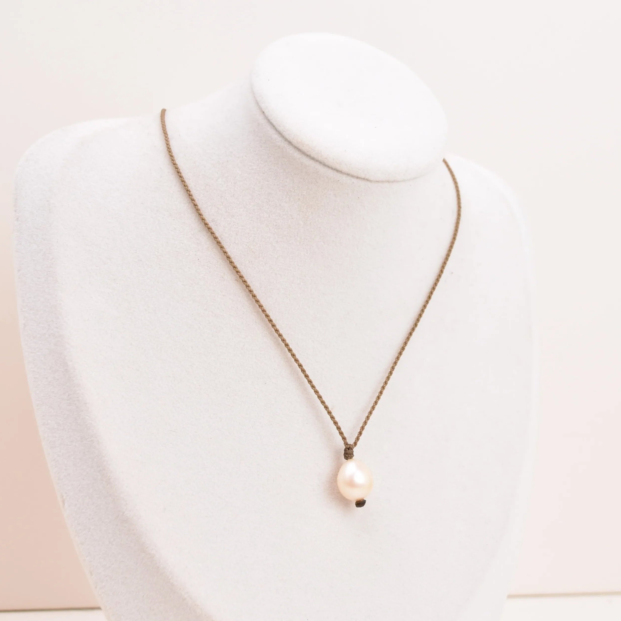 Pearl Drop Necklace in Peach on white bust