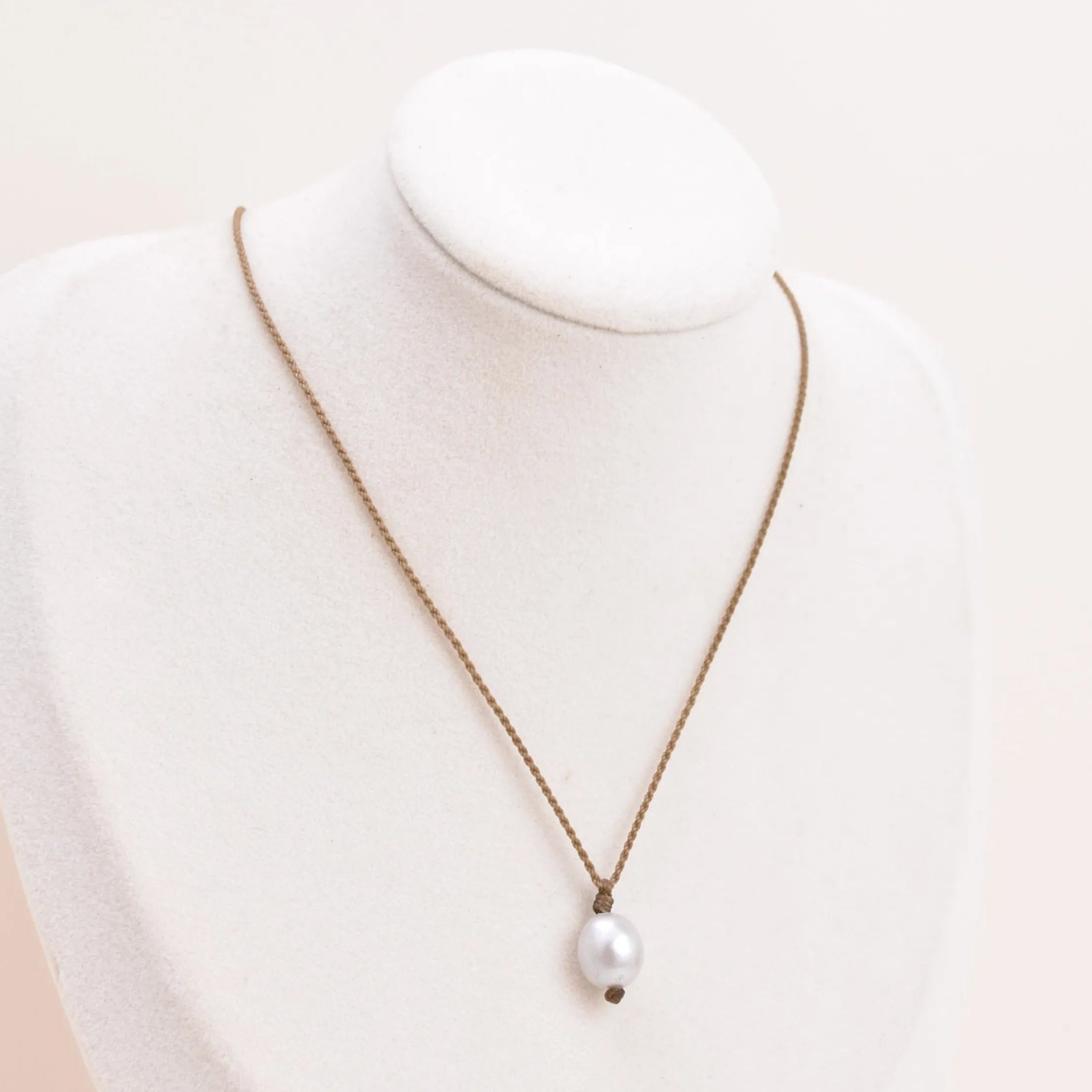 Pearl Drop Necklace in Silver on a white bust