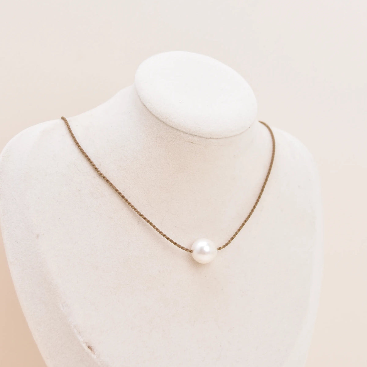 Classic Pearl Necklace with one white Edison freshwater pearl on hand-spun rope, displayed on a bust