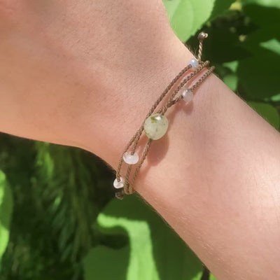 Video of Mental Health Matters Riptide Bracelet on model's wrist in front of green leaves