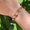 Video of Mental Health Matters Riptide Bracelet on model's wrist in front of green leaves