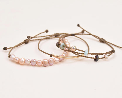 crown of the seven seas bracelet stack in blush layout spread on white background