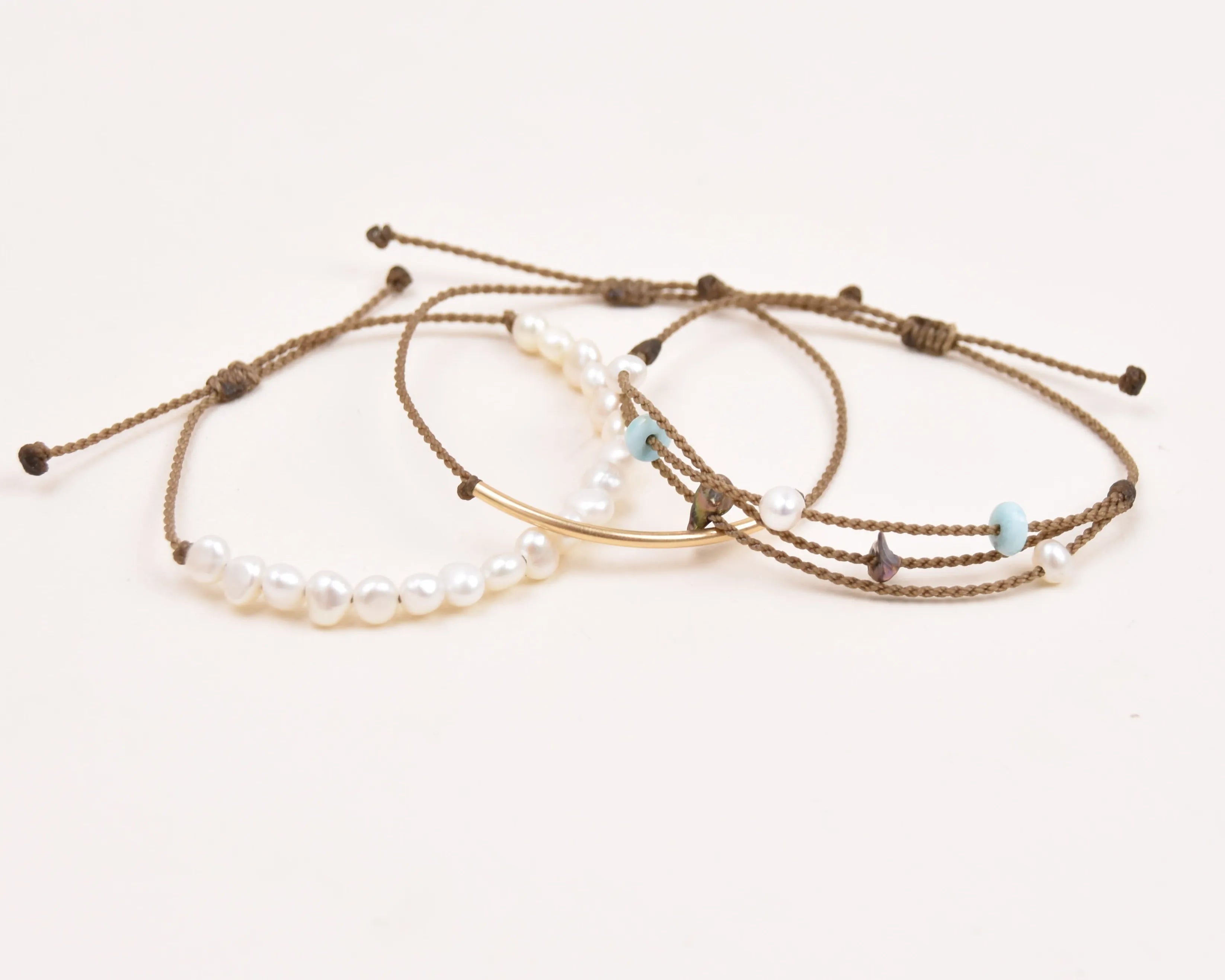 crown of the seven seas bracelet stack in white layout on white background