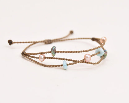 Seven Seas X PADI Riptide Bracelet with central blush pearl on white background