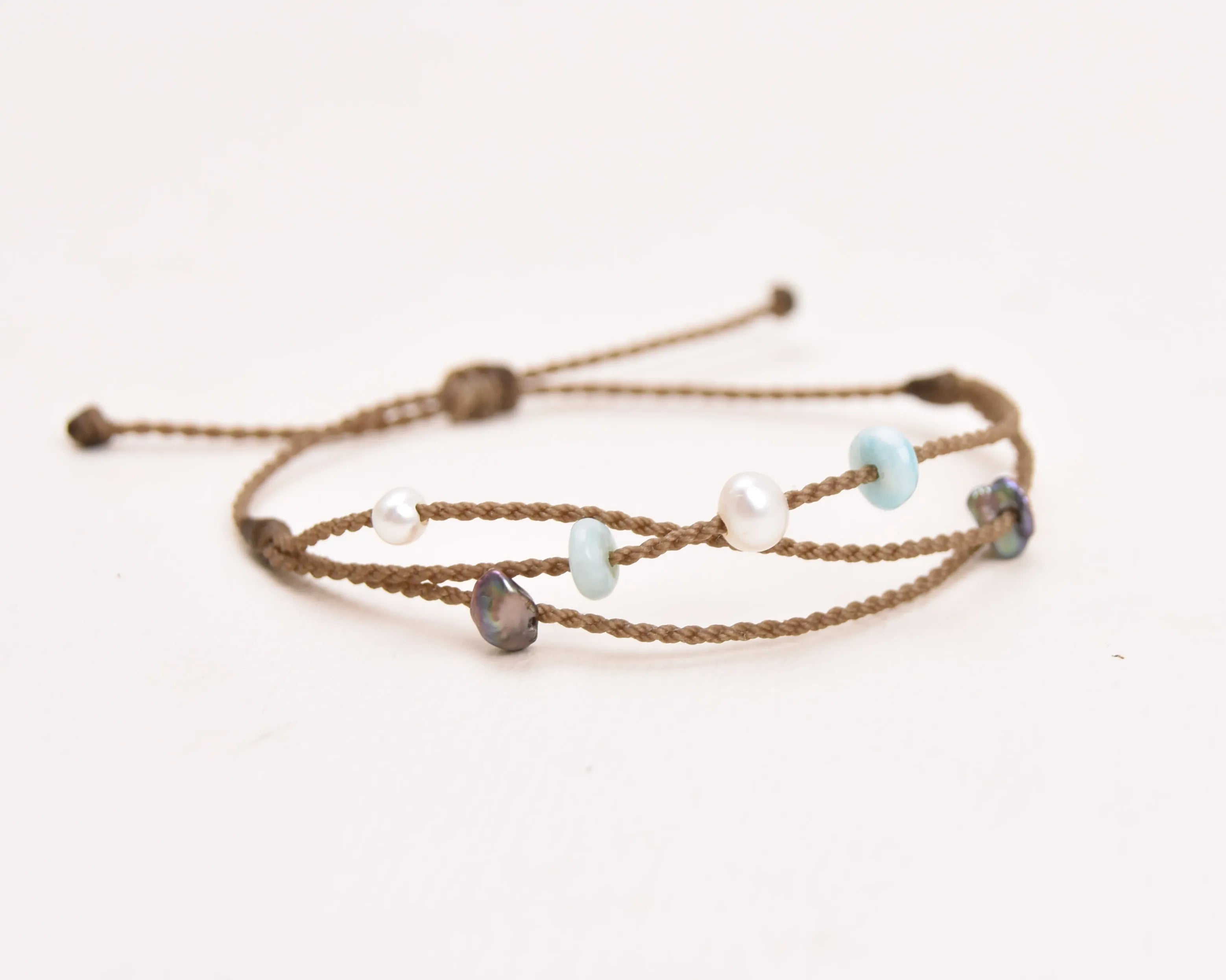 Seven Seas X PADI Riptide Bracelet with white central pearl on white background