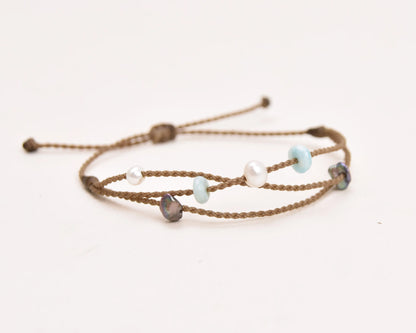 Seven Seas X PADI Riptide Bracelet with white central pearl on white background