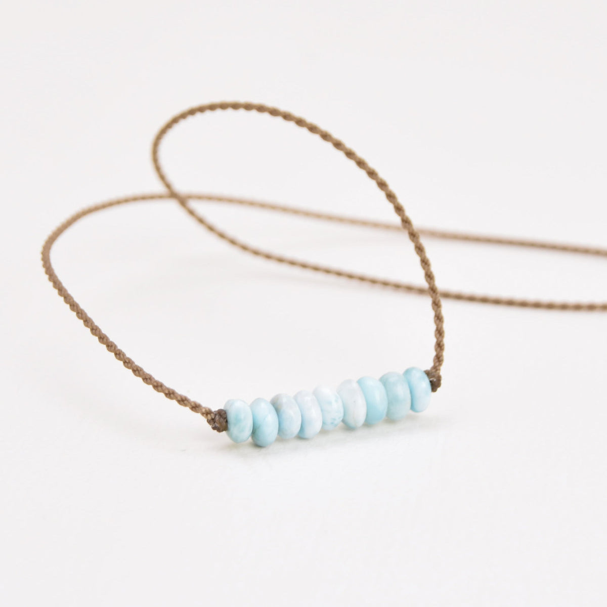 Live In Stone Necklace in larimar, light blue larimar stones on hand-spun waterproof rope